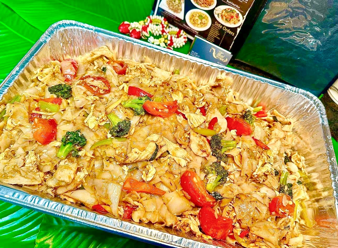 Small catering tray of Kee Mao drunken noodles with wide rice noodles and vegetables